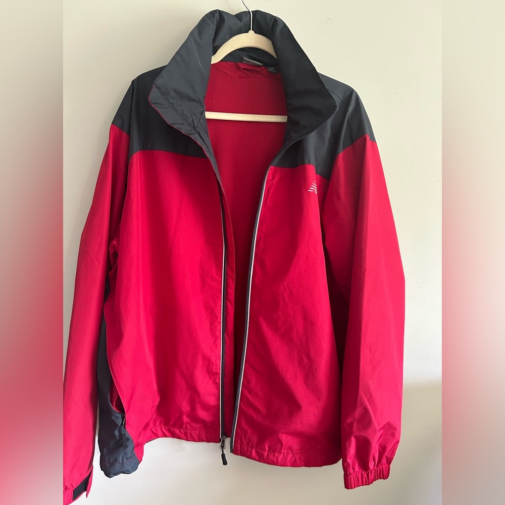 New balance windbreaker jacket with hidden hood. XL